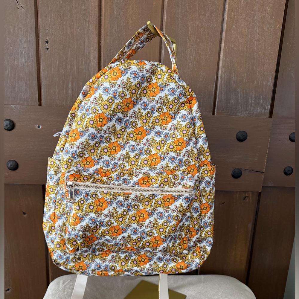 Add some color to your wardrobe with this  Floral Orange and Yellow Backpack.
